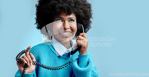 Image of Telecom landline, phone or black woman talking, communication on blue mockup studio background. Happy, smile or young African girl model speaking to contact on vintage phone with mock up space