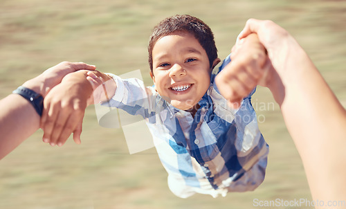 Image of Family, happy and swing with child and arms of parent in garden for fun, smile or love. Health, support and holding hands with son and dad playing outdoors for summer, lifestyle and motion together