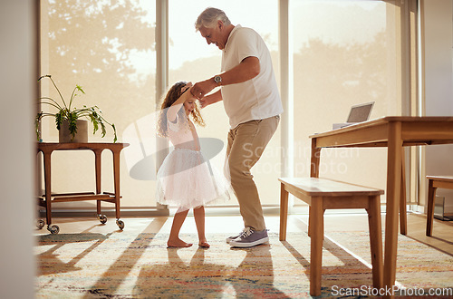Image of Grandfather, girl and dance holding hands in living room home. Love, smile and happy cute daughter dancing with caring grandpa spending time together, bonding and care having fun on weekend in house.