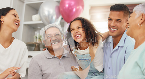 Image of Happy birthday, party and girl in celebration with family as her mother, father and grandparents enjoy a special day together. Dad, mom and excited child celebrating with an elderly woman and old man