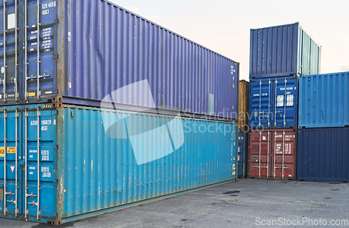 Image of Container, logistics and port at storage in shipyard for global supply chain on sea. Shipping, cargo and transport distribution of goods, for import and export at international harbour in Cape Town