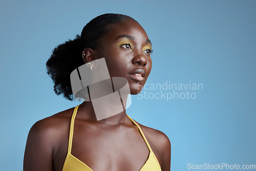 Image of Black woman beauty and yellow makeup cosmetics model for eye product in blue background studio mockup. Nigeria African young girl pose for natural hair care, healthy skincare and afro empowerment