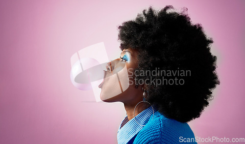 Image of Bubble gum, afro hair and black woman on pink studio background with fashion, cool or Jamaican trend hairstyle. Profile, head or beauty model with bubblegum, makeup cosmetics and bold or fun attitude