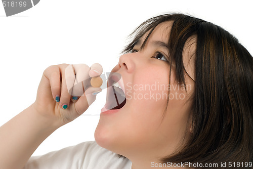 Image of Girl Taking Vitamin C