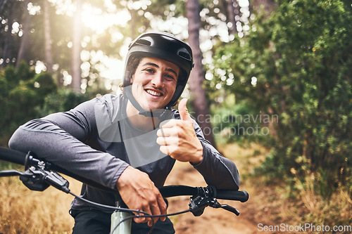 Image of Thumbs up man rider on mountain bicycle happy riding or training for fitness, wellness and health exercise outdoor. Cycling, active and workout sports athlete smile for success, motivation and cardio