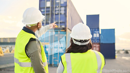 Image of Industrial managers working on a warehouse dock to export stock, containers and packages. Teamwork, collaboration and logistics industry employees discussing shipping at an outdoor cargo freight port