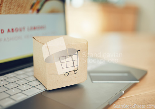 Image of Online shopping, courier service and credit card for delivery, ecommerce or website stock. Laptop, cardboard box package with digital payment technology, supply chain shipping or product distribution