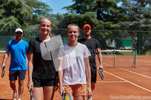 Image of Tennis club together after hard training, showing their dedication, hard work, and teamwork.