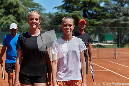 Image of Tennis club together after hard training, showing their dedication, hard work, and teamwork.