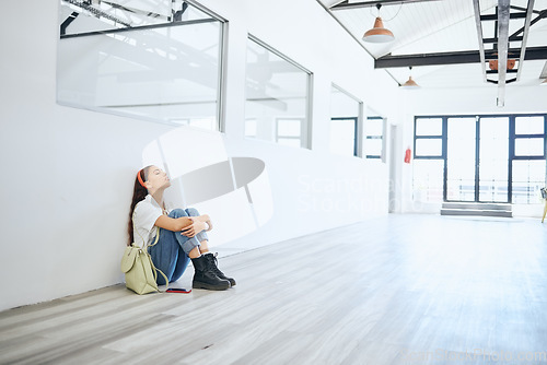 Image of Stress, burnout and mental health with a woman student thinking about exam, education finance and life stress. Young female frustrated with university, college or school debt in a campus hall or room