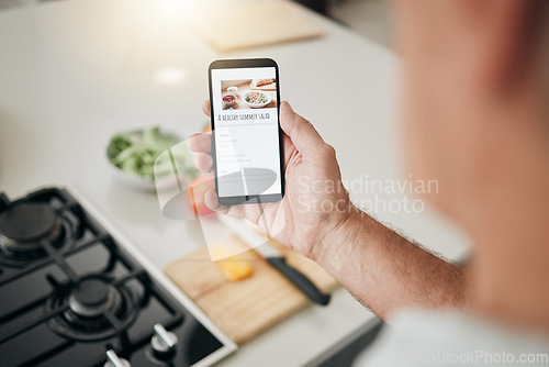 Image of Phone screen, cooking recipe and man with healthy kitchen salad information on website, digital blog or vegan food app. Hand with smartphone, internet or online inspiration advice for green lifestyle