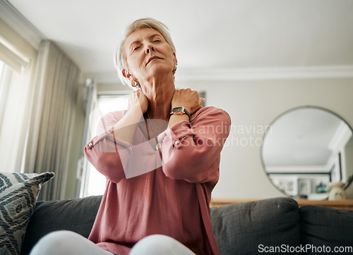 Image of Senior woman, neck pain and stress in living room home of spine injury, fibromyalgia and osteoporosis. Sick, tired and fatigue lady in orthopedic, arthritis and health problem stretching body muscle