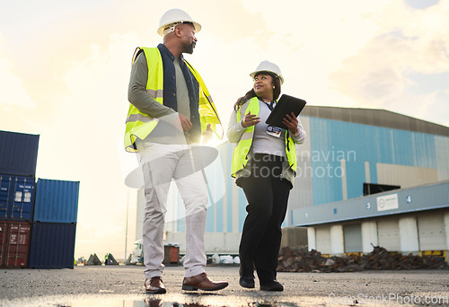 Image of Logistics, black woman and delivery manager at a warehouse for cargo shipping, inventory and distribution. Collaboration, teamwork and industry worker in a conversation on stock inspection report