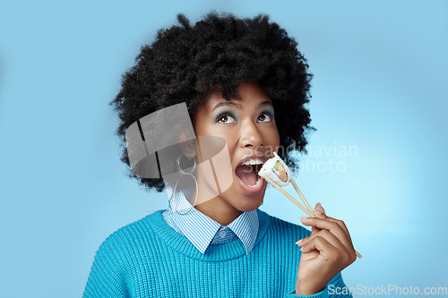Image of Sushi, seafood and black woman with smile for seafood from Japan against a blue mockup studio background. African girl eating fish for dinner diet and luxury lunch from restaurant with mock up space