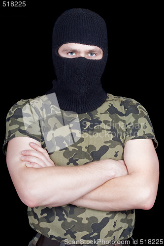 Image of The man in a black mask over black