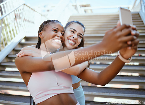 Image of Diversity, phone and fitness friends take selfie as girls running, training and cardio workout outdoors together. Sports, Smile and black woman with Latino best friend in Washington DC to exercise