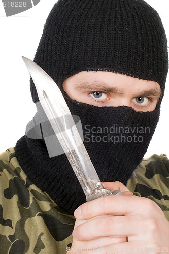 Image of Portrait of the criminal in a black mask with a knife 