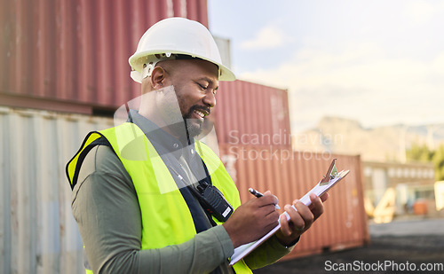 Image of Logistics, inspection, shipping and black man writing notes working at storage container port. African industrial manager happy with documents for cargo at an outdoor manufacturing warehouse