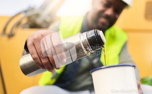 Image of Black man and construction worker on lunch for coffee or tea in cup on site, doing cargo and shipping. Male contractor, smile and guy use mug for hot beverage in flask and helmet for logistics work.