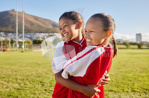 Image of Football, girl and sports children hug, smile and happy together having fun, bond and enjoy outdoor game. Friends, young kids or teammates embrace on Brazil soccer field for youth academy training