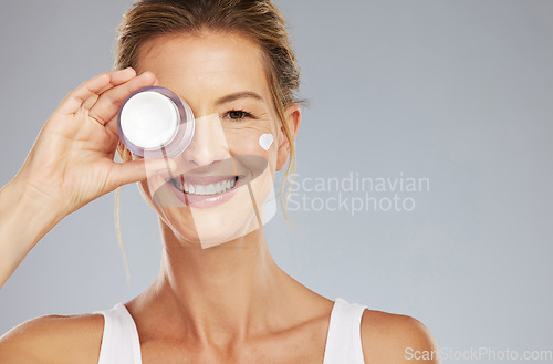 Image of Woman and cream on face portrait for beauty skincare wellness and routine product mockup. Satisfied, happy and attractive mature lady with facial dermatology cream for cosmetic skin anti aging