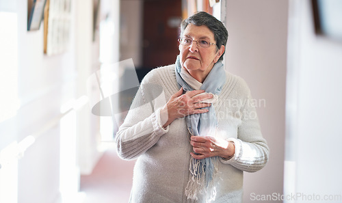 Image of Retirement, wow and lifestyle with a senior woman with gray hair looking shocked or surprised in her home. Shock, surprise and awe with an elderly female pensioner in her house alone during the day