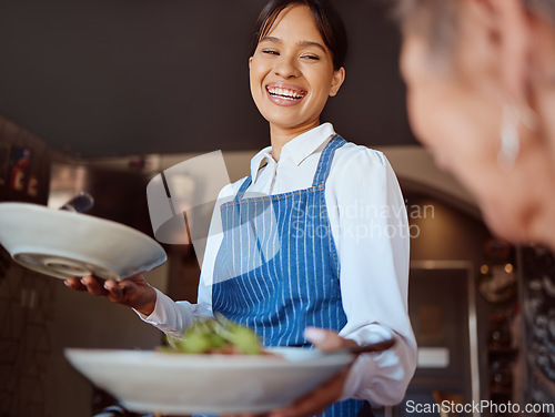 Image of Waitress in a restaurant, serving customer her food, healthy salad and gives service with a smile. Woman in the hospitality industry, friendly laugh and happy to provide diet meal for lunch or dinner