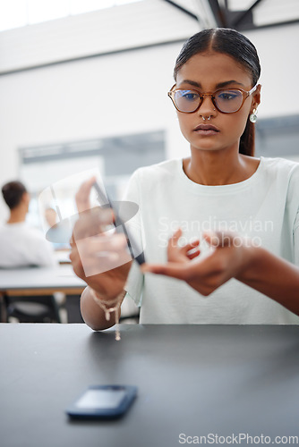 Image of Education, pen and student woman in classroom relax during lesson free time at university, college or school campus. Study, scholarship and gen z India girl with face jewelry learning at class course