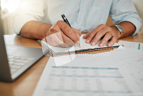 Image of Financial planning, finance report and businessman writing notes about payment at desk in office at work. Hands of corporate accountant working on accounting management and tax in notebook at table