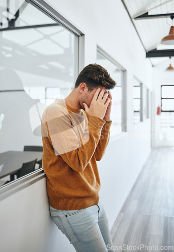 Image of Headache, stress and student with head in hands at university frustrated with school work load. Mental health, anxiety and depression at exam time, man from Canada suffering from deadline pressure.