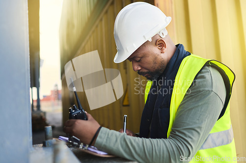 Image of Logistics, supply chain and documents with a man shipping worker on a commercial container dock with a radio and clipboard. Stock, cargo and freight with a male courier working in the export industry