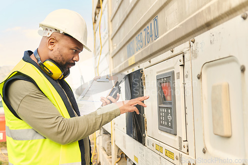 Image of Logistics engineer, refrigerator and shipping container with keypad for cooling regulations. Industrial manager, leadership and black man with walkie talkie, e commerce delivery or supply chain cargo