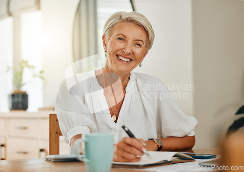 Image of Freelance writer, senior woman and writing in notebook or planner feeling happy, relax and enjoying retirement to be creative and organized at home. Portrait of old lady sitting in Australia house