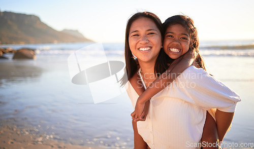 Image of Happy mother and girl have fun together at the beach in the sun on summer vacation. Carefree woman carrying excited child while bonding outdoor. Single mom enjoy quality time with kid at the ocean