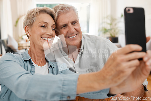 Image of Senior couple taking selfie with phone, smile in love with 5g and technology for social media in marriage at house. Happy, married and smiling man and woman streaming, communication or video call