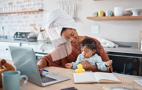 Image of Down syndrome, baby and laptop with mother working in a kitchen, bonding and doing research on child development. Learning, freelance and disability care with remote business woman multitasking