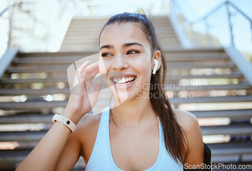 Image of City fitness, happy woman and music earphones for training, motivation and exercise in urban Colombia outdoors. Sports athlete, runner and healthy person listening to audio for cardio running workout