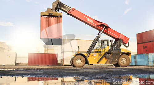 Image of Container, forklift and port for supply chain, logistics and cargo industry. Vehicle, crane and transport of stock for shipping with tractor, machine or industrial loader at shipyard in Cape Town