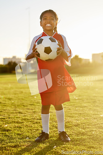 Image of Football, portrait and girl soccer player on a sports ground ready for a ball game or training match outdoors. Smile, fitness and young kid excited for practice workout on field of grass in Sao Paulo