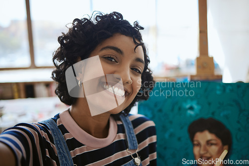 Image of Art, selfie and Indian woman with painting on canvas while working in a creative studio. Face portrait of a girl, artist or painter taking a photo with paint job with smile in creativity workshop