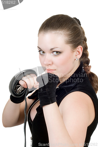 Image of Pretty young angry woman throwing a punch over white