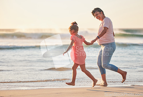 Image of Family, child and grandma running on beach vacation having fun, energy and adventure with mature and girl holding hands on tropical summer trip. Active grandparent and happy kid traveling by the sea