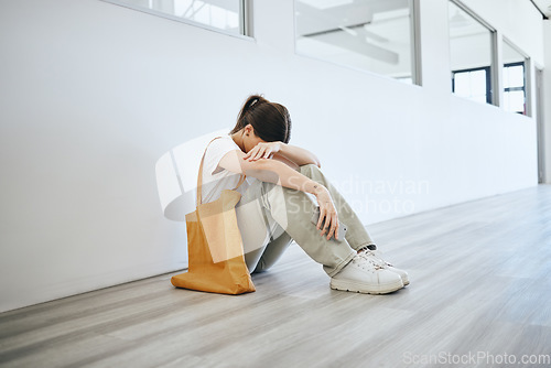 Image of Depression, stress and woman on the floor on an office, frustrated and suffering with mental health problem. Burnout, anxiety and pressure by jobless female feeling hopeless looking for a job