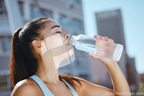 Image of Relax, fitness and water drink girl on hydration break with outdoor summer cardio workout training. Thirsty exercise woman enjoying aqua beverage from bottle to hydrate body for health lifestyle.