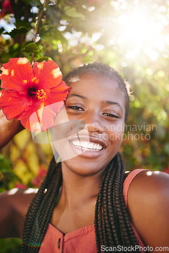 Image of Beauty, flower and flare portrait of black woman happy, smile and enjoy Summer holiday or vacation in Jamaica. Happiness, skincare and wellness girl at peace, freedom or relax in outdoor nature park