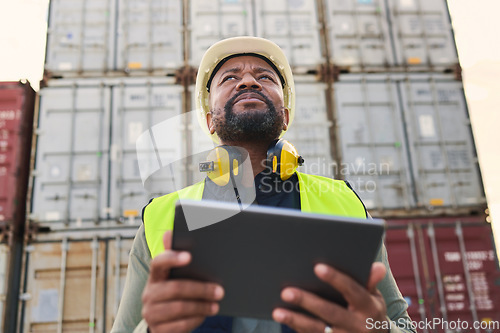 Image of Logistics, tablet and black man doing container inspection at an industrial cargo, shipping and freight supply chain. Delivery manager or industry worker working at a distribution trade port outdoors