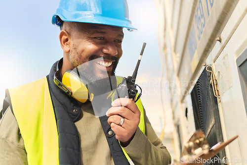 Image of Logistics, communication and black man talking on walkie talkie working on delivery of cargo at shipping port. African industrial worker speaking on tech about stock at manufacturing warehouse