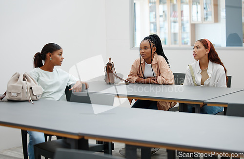 Image of Student friends and talk in university cafeteria for course guidance and thoughts in break. Young and diverse women in friendship at education facility discuss lecture study group plan.