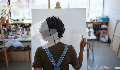 Image of Painting artist, blank canvas and creative woman thinking of inspiration in studio workshop or art class. Creativity, drawing or sketch painter girl busy or ready to start on artwork project on easel