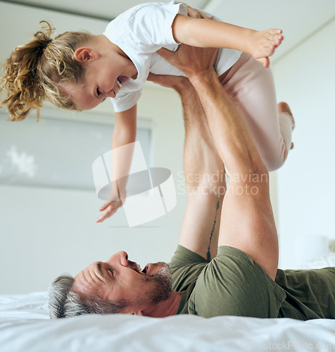 Image of Family, dad and lifting daughter on bed while having fun and enjoying time together bonding during airplane game family activity. Playing, support and laughing man and girl child in bedroom at home